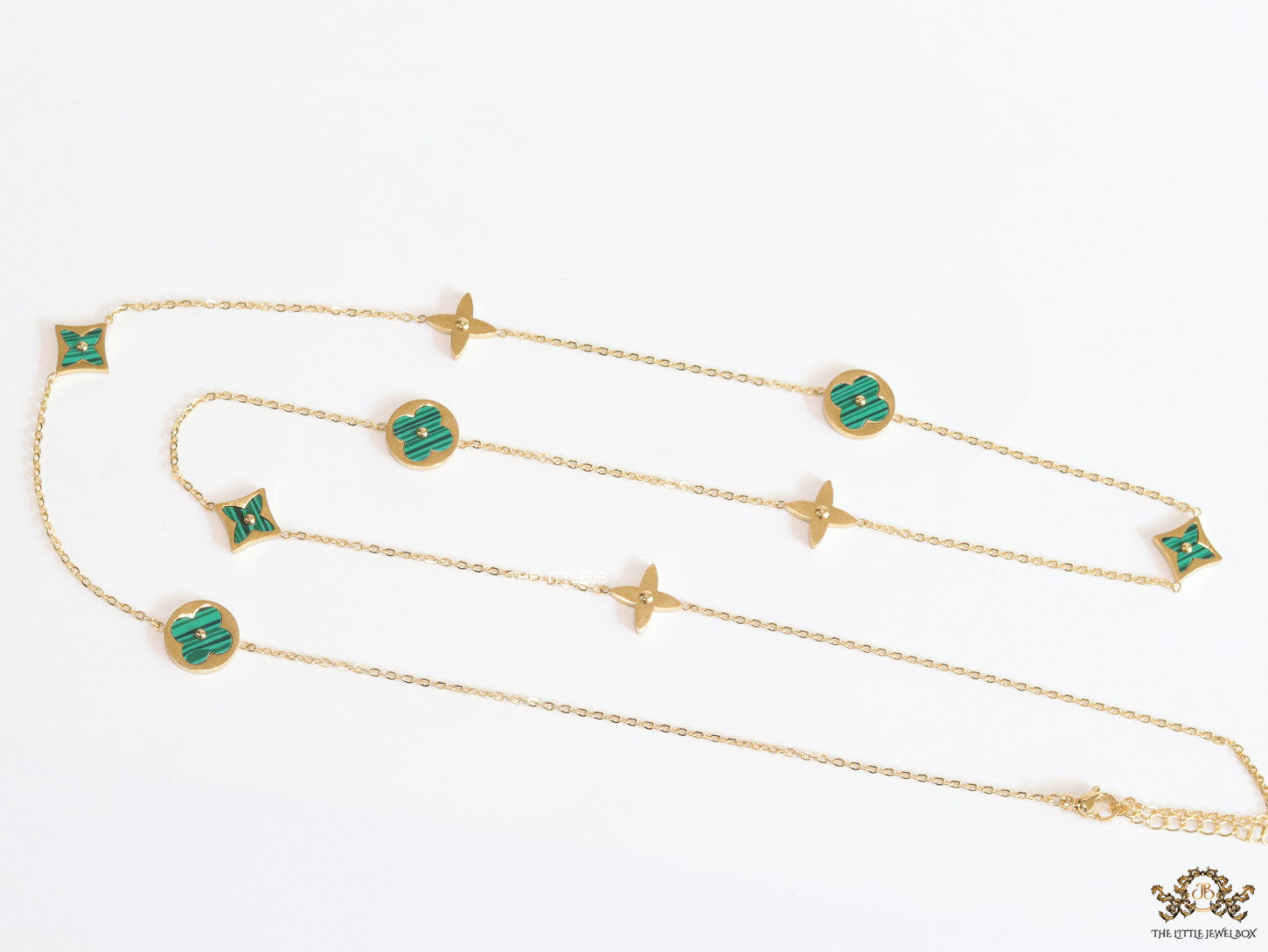 Golden chain necklace with malachite green clovers