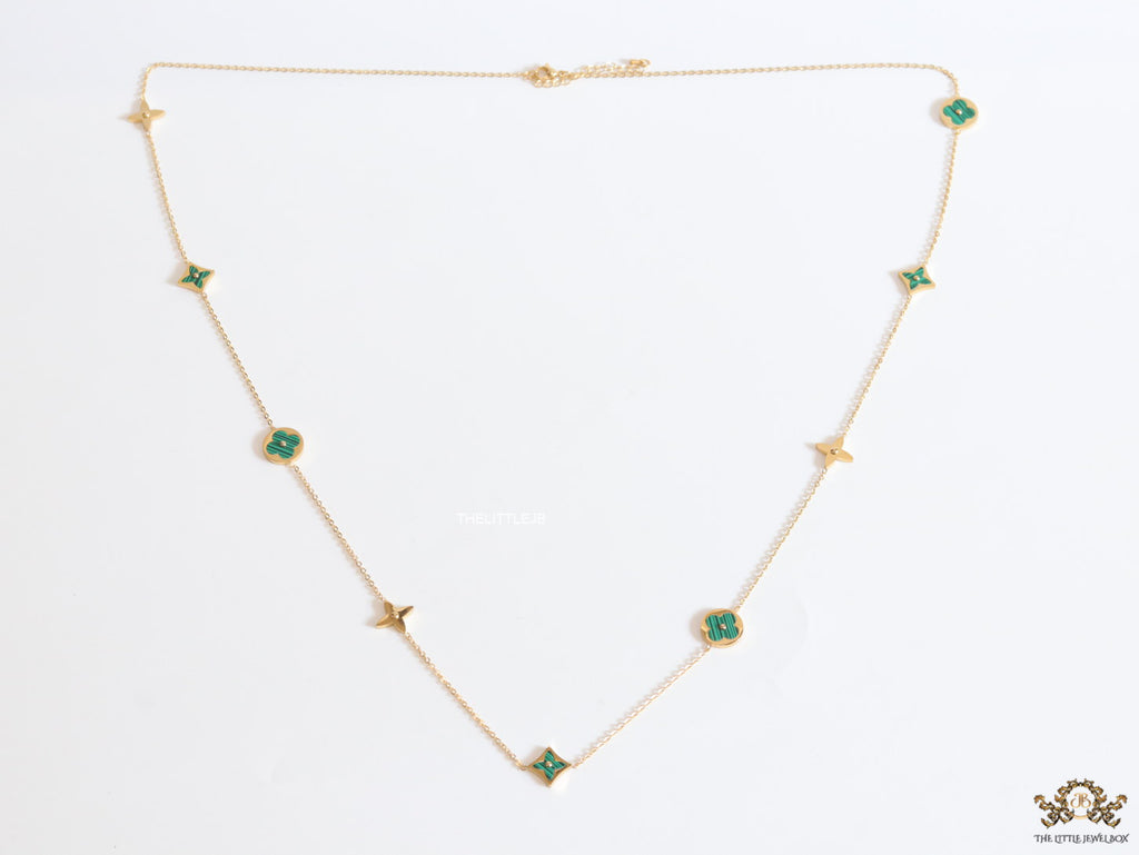 Golden chain necklace with malachite green clovers
