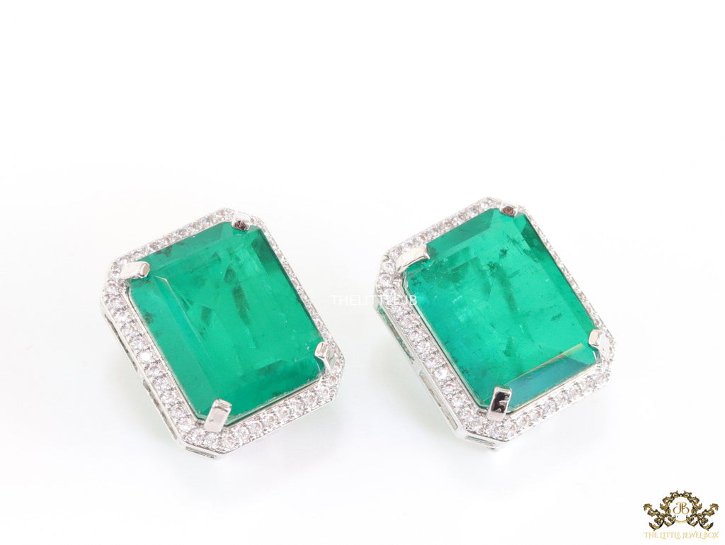 Platinum plated studs with emerald green doublet stone and white cubic zirconia stones lining