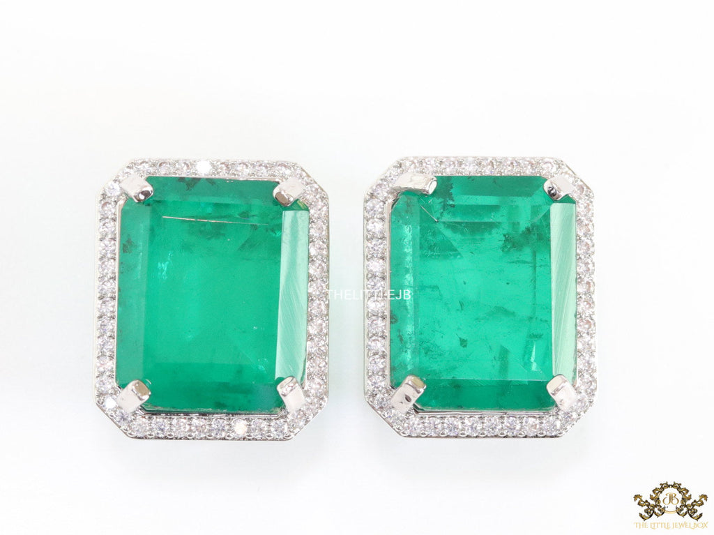 Platinum plated studs with emerald green doublet stone and white cubic zirconia stones lining