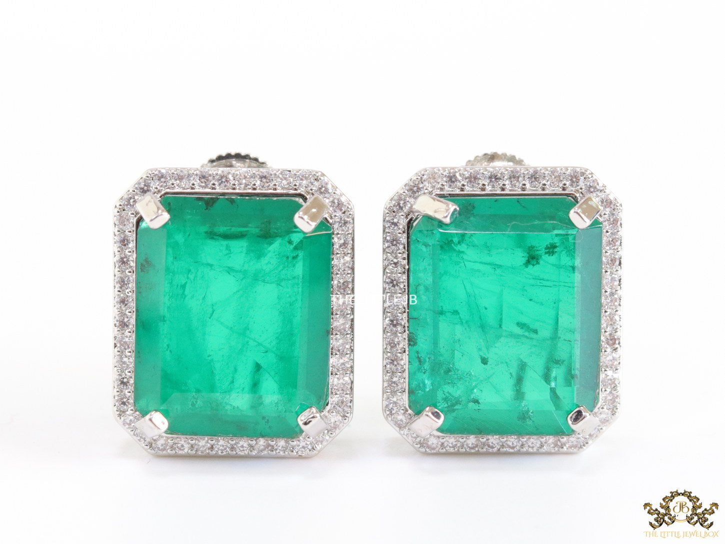 Platinum plated studs with emerald green doublet stone and white cubic zirconia stones lining