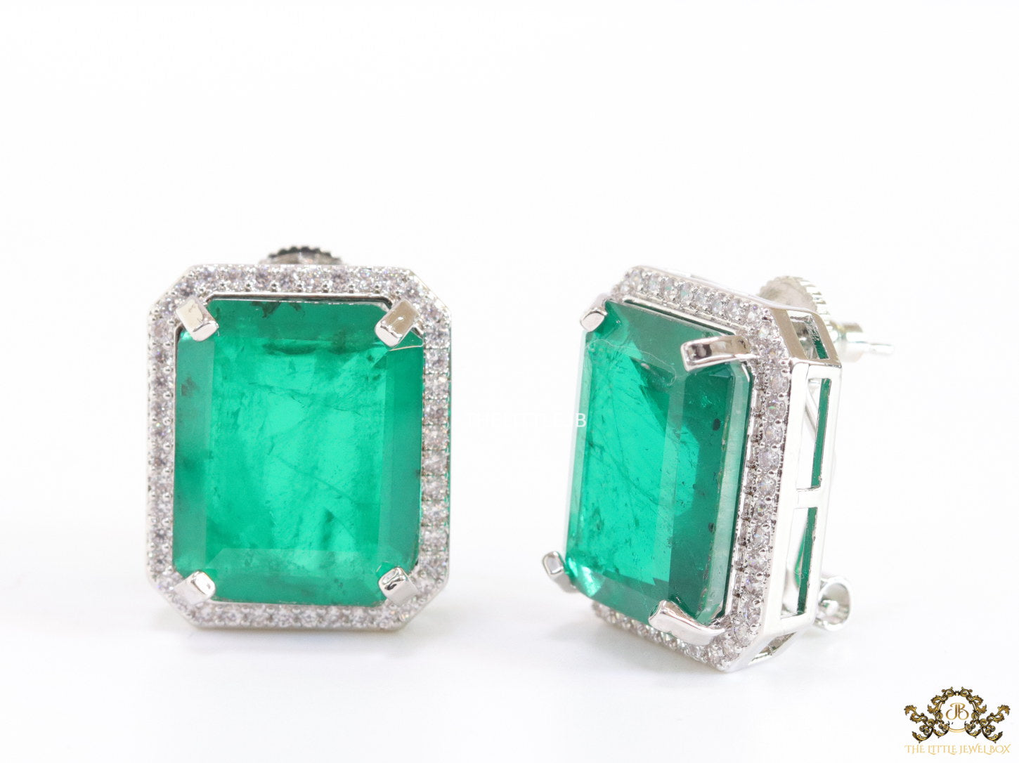 Platinum plated studs with emerald green doublet stone and white cubic zirconia stones lining