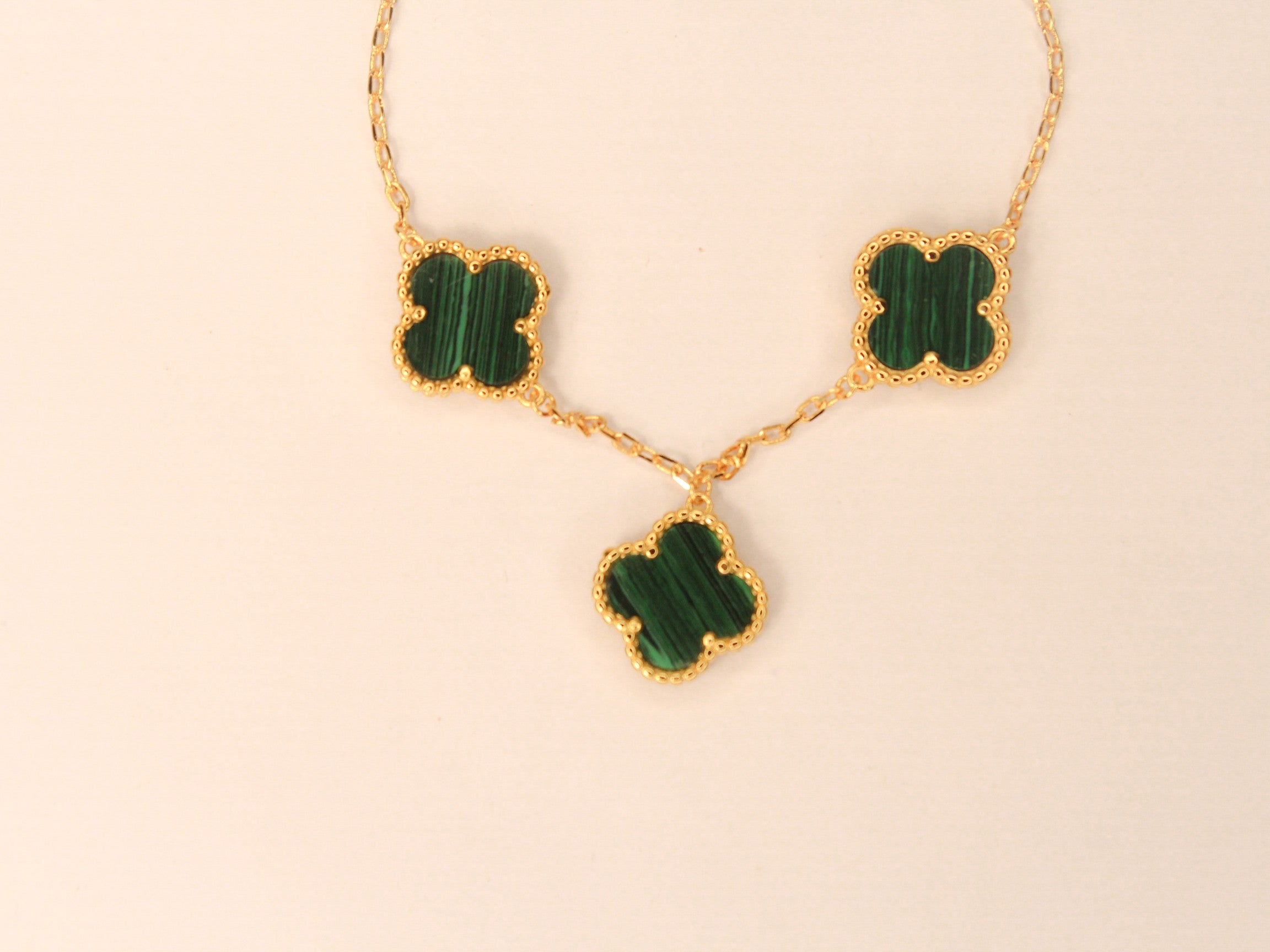 Gold Clover charms bracelet in green