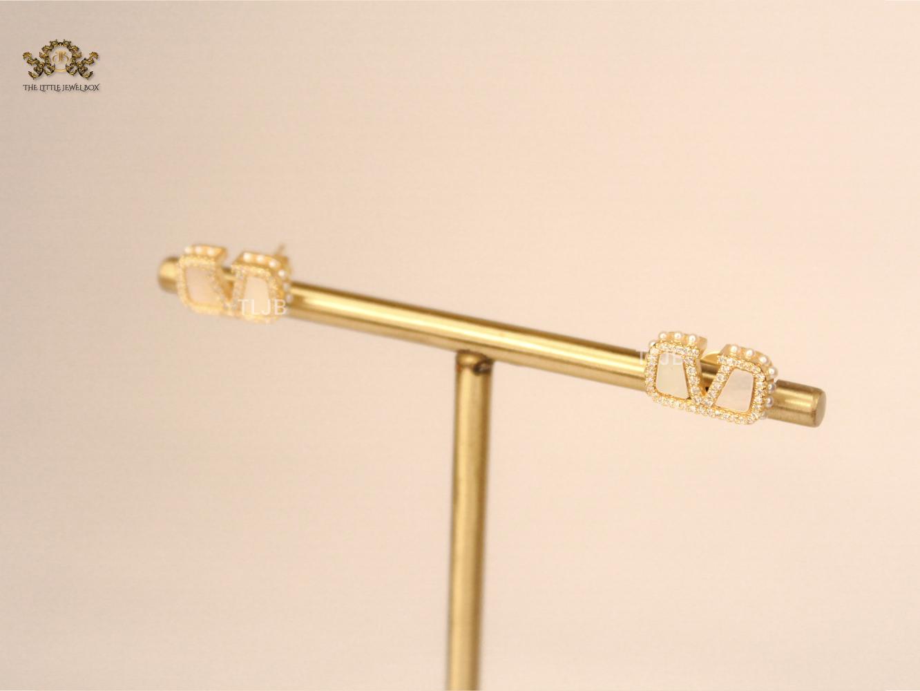 Alphabet V white mop earrings