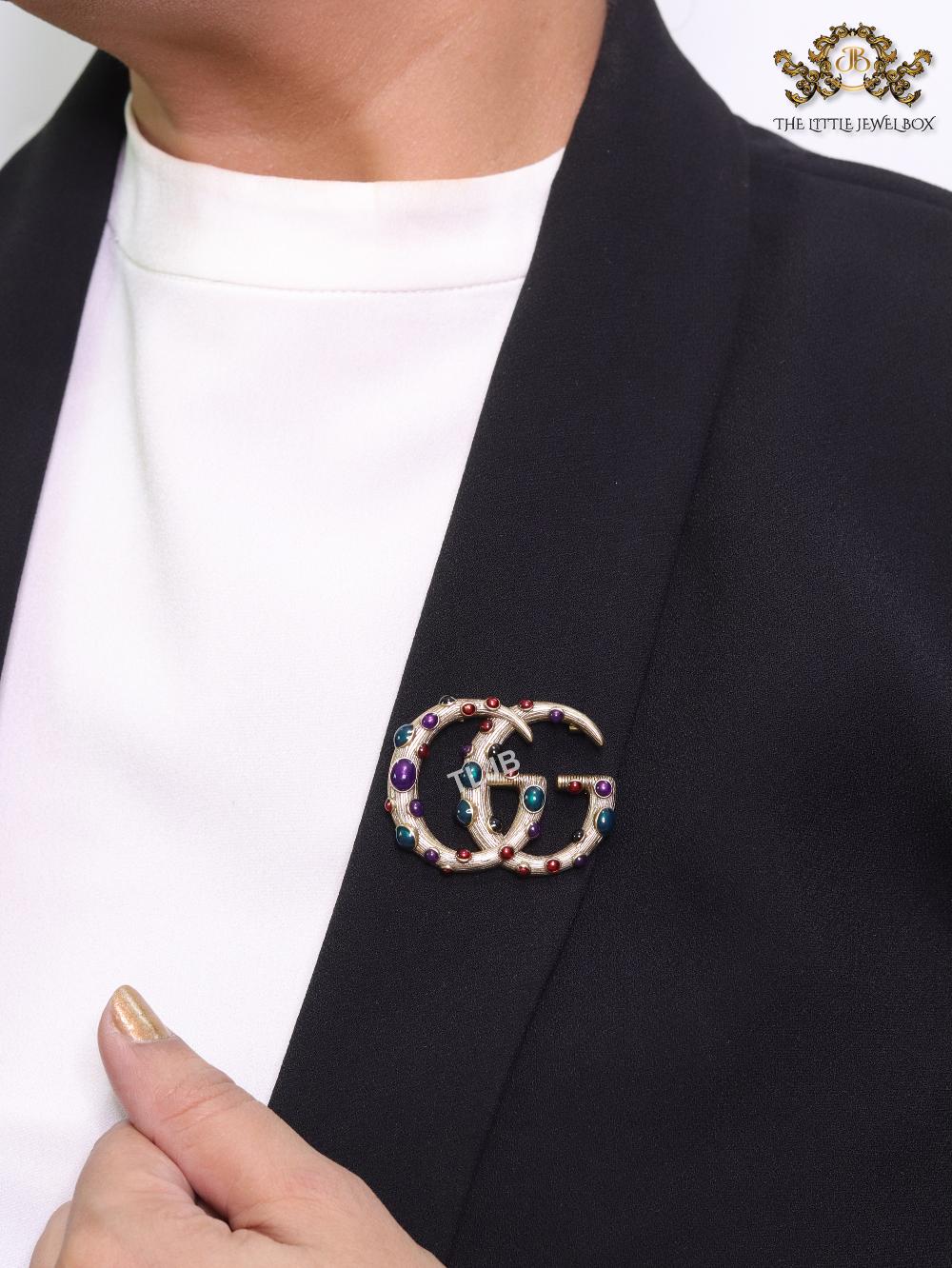 Rustic twin G brooch with multi coloured stones