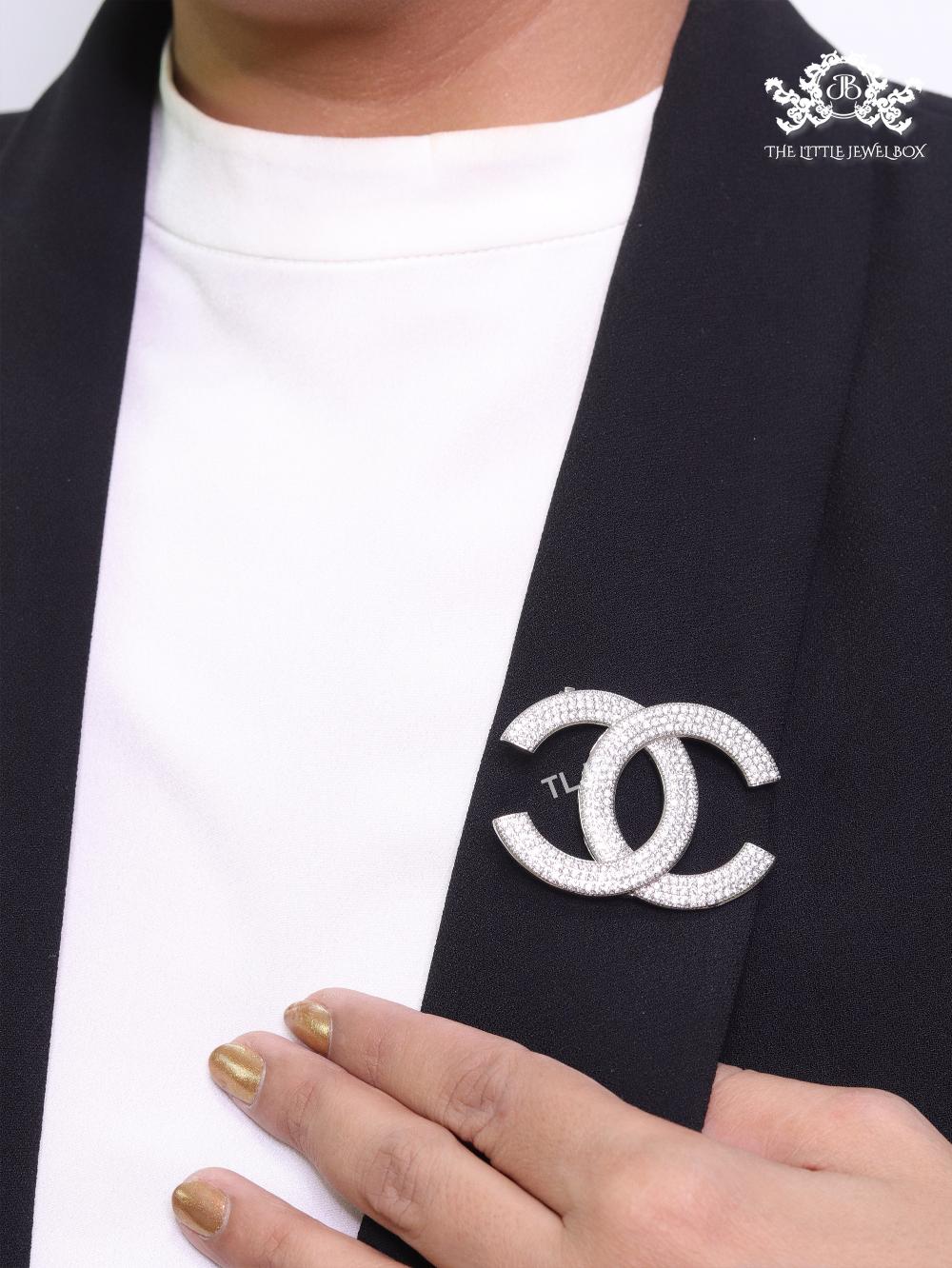 Platinum plated twin C brooch with cz