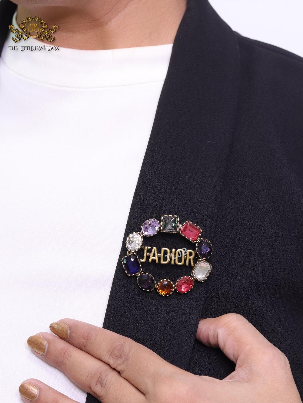 Multi stone brooch with alphabets