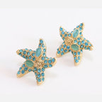 Aqua gold star studs