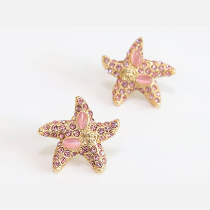 Pink gold star studs