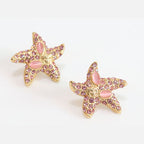 Pink gold star studs