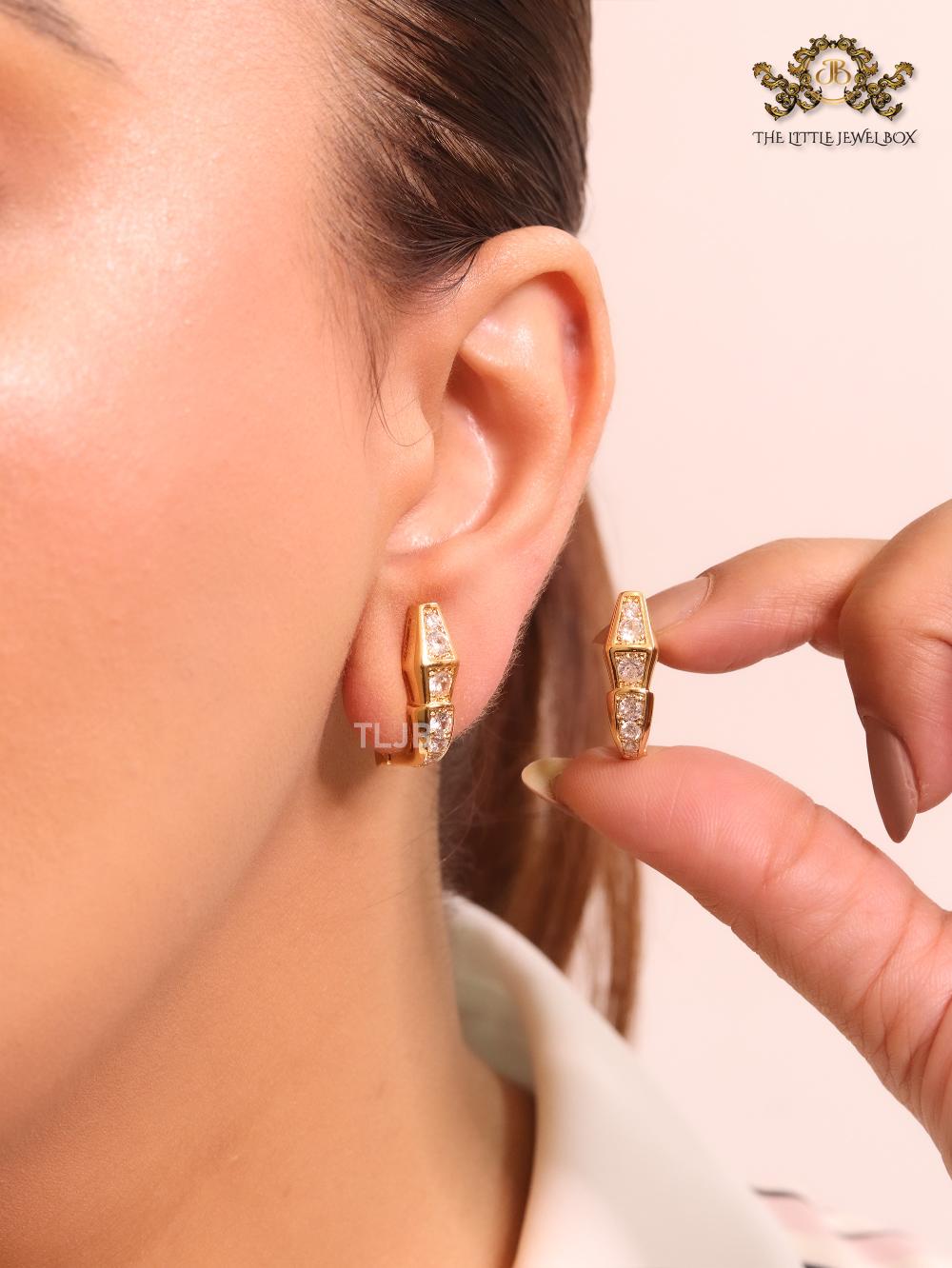 Gold and cz serpentine studs