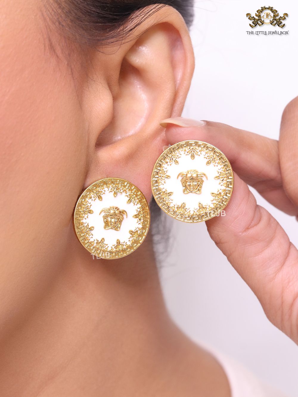 Medusa gold and white studs