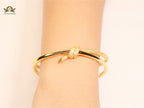 Alphabet T& Co knot bracelet in gold