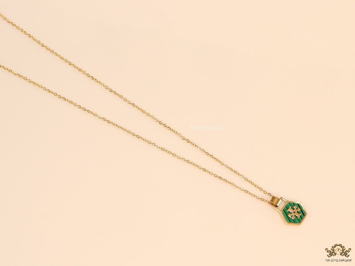 Gold plated necklace with malachite green T motif pendant