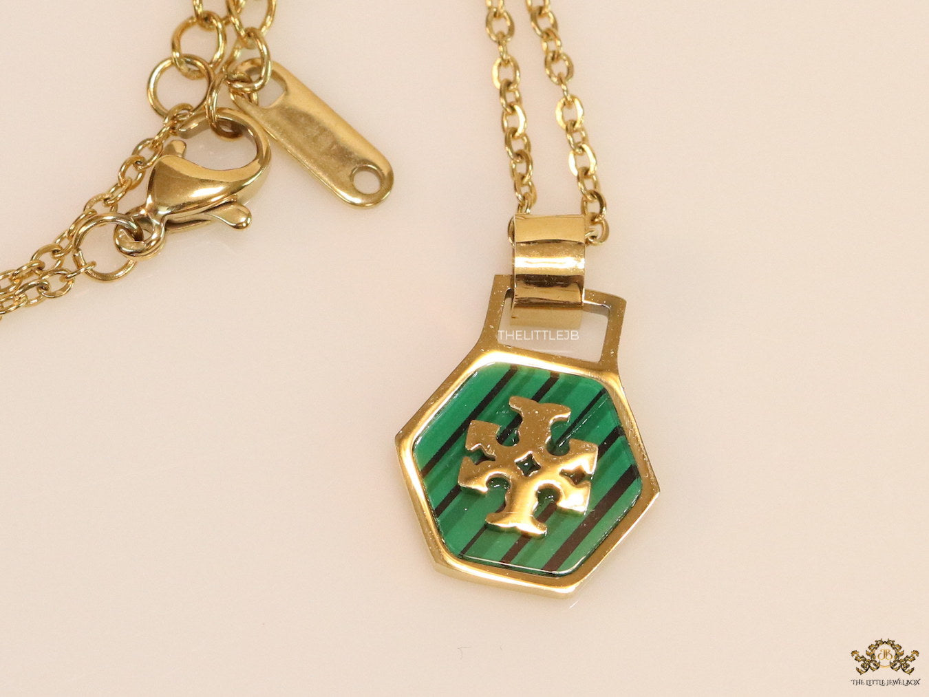 Gold plated necklace with malachite green T motif pendant