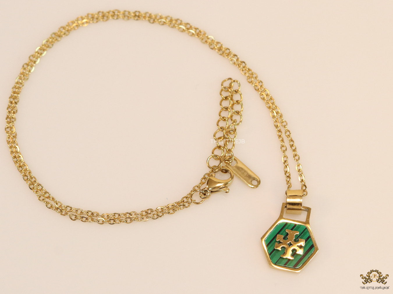 Gold plated necklace with malachite green T motif pendant