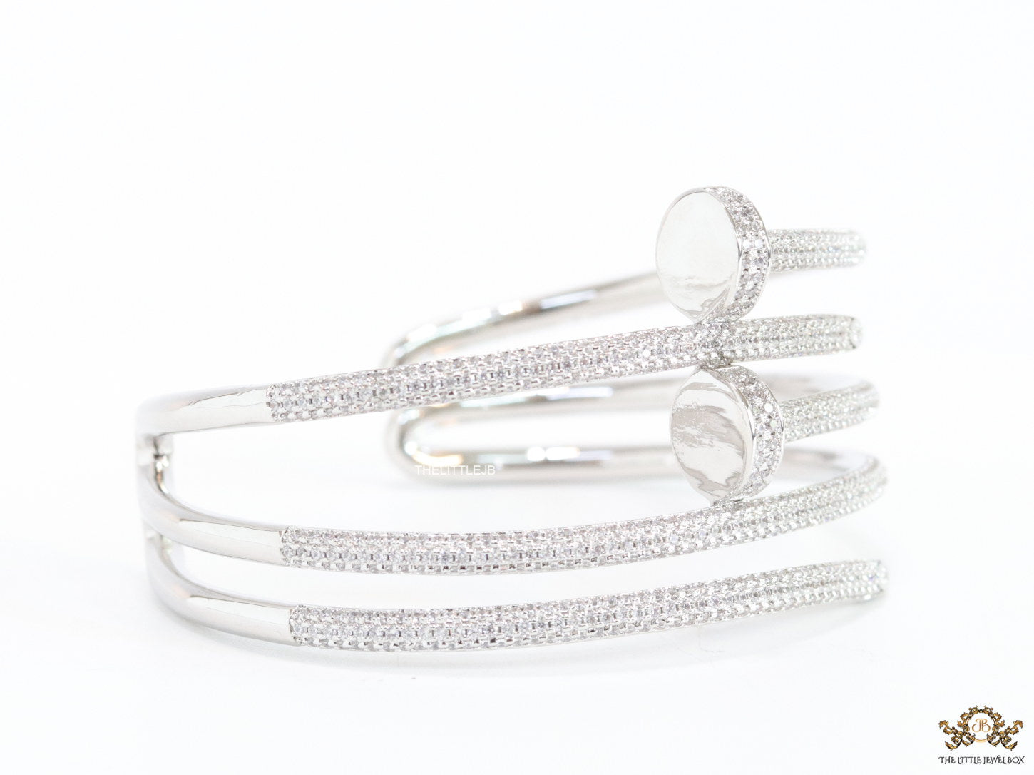 Platinum plated twin nail bracelet with cz