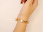Gold and pearl Tiff & Co linked chain bracelet
