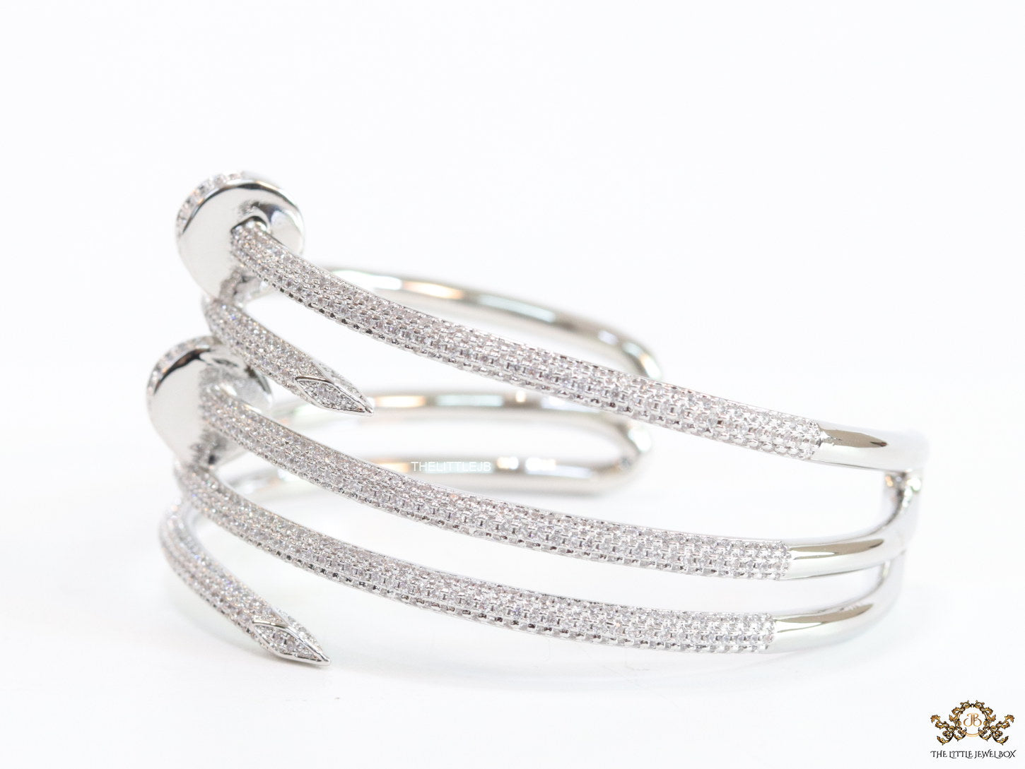 Platinum plated twin nail bracelet with cz