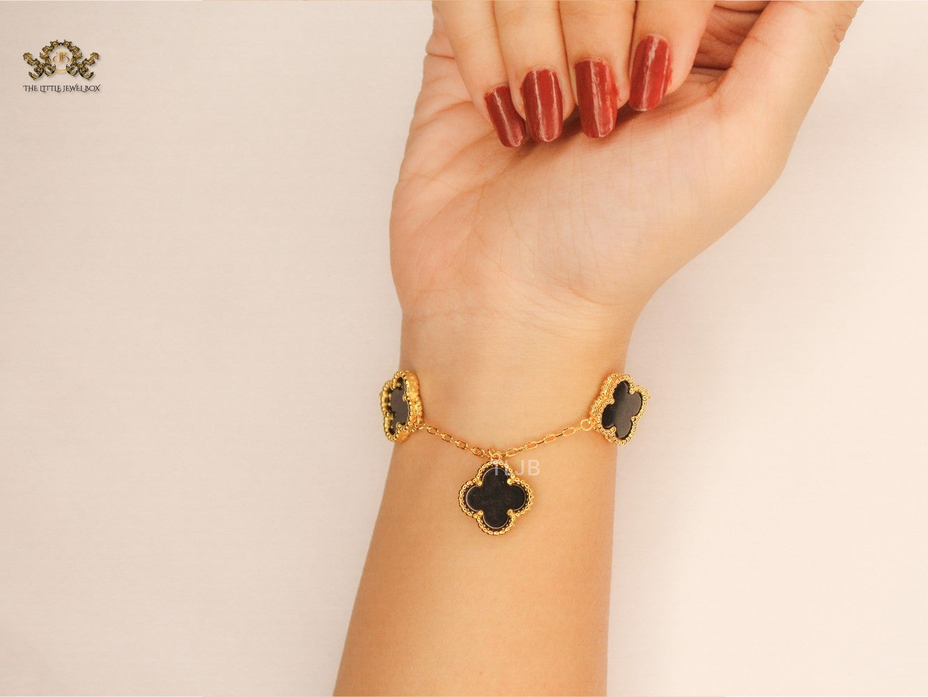 Gold Clover charms bracelet in Black