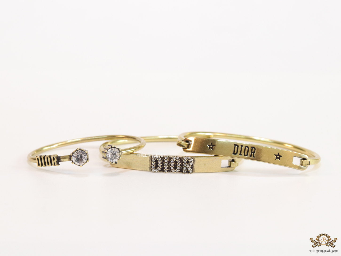 Multilayered golden alphabet bracelet with cz