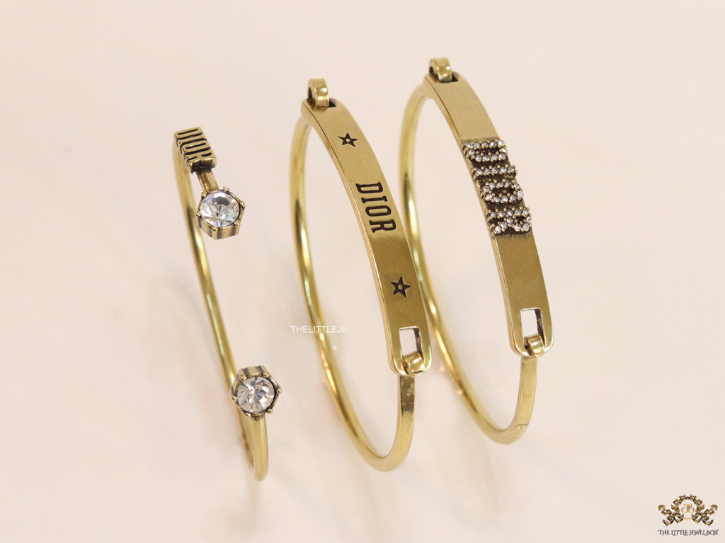 Multilayered golden alphabet bracelet with cz