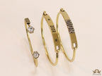 Multilayered golden alphabet bracelet with cz