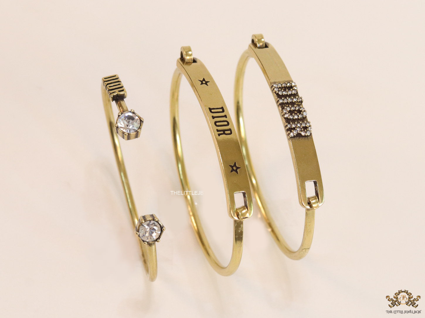 Multilayered golden alphabet bracelet with cz
