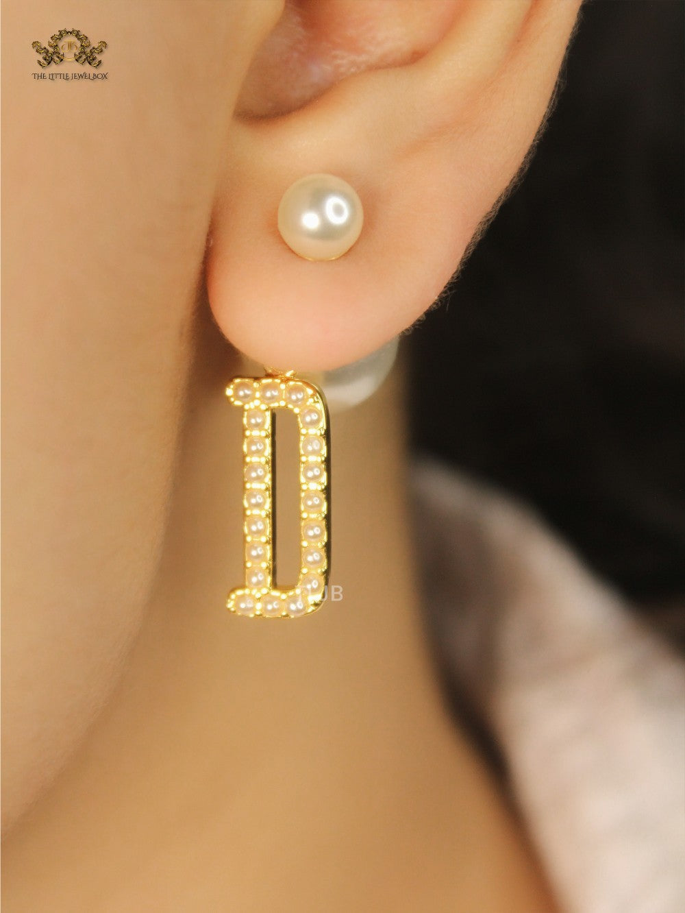 alphabet D pearl studded bomber earrings