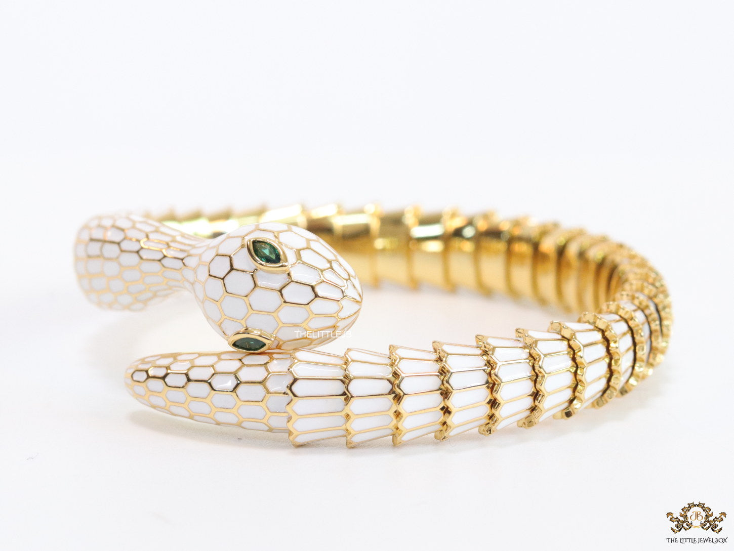 Serpentine open bracelet in white enamel and golden finish