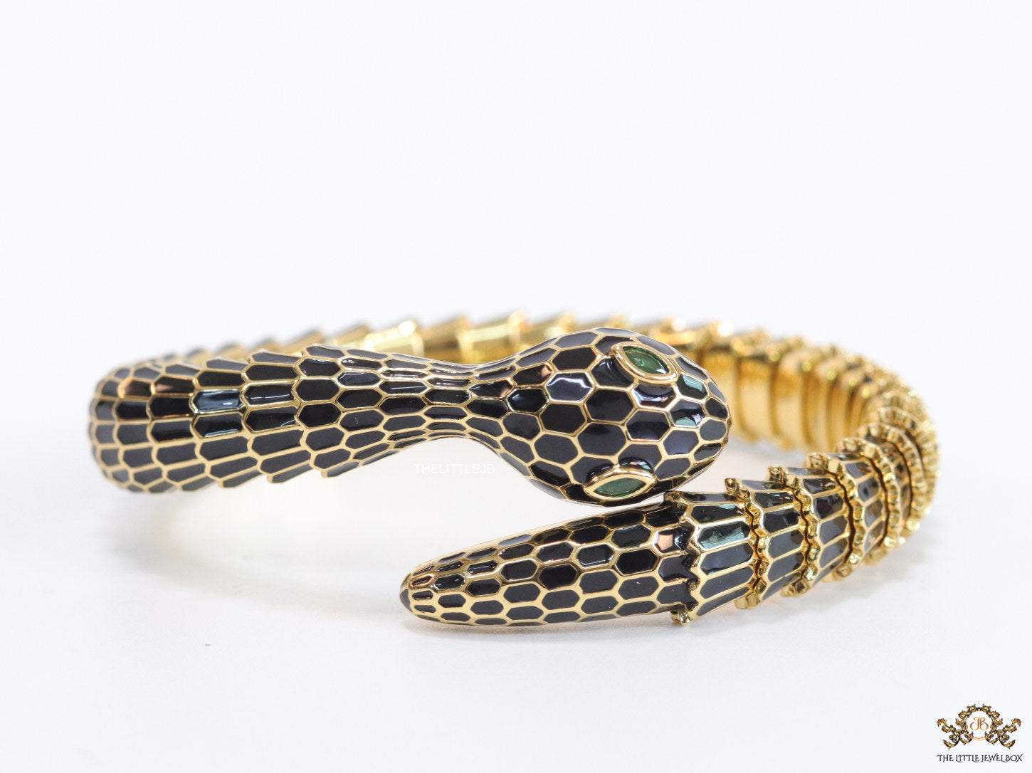 Serpentine open bracelet in black and golden finish