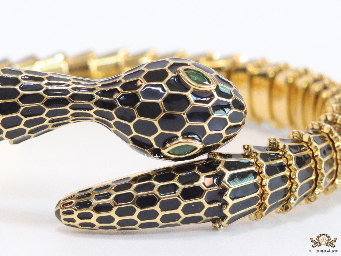 snake open bracelet in black and golden finish