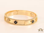 Gold plated bracelet with clover motifs in cz and black enamel