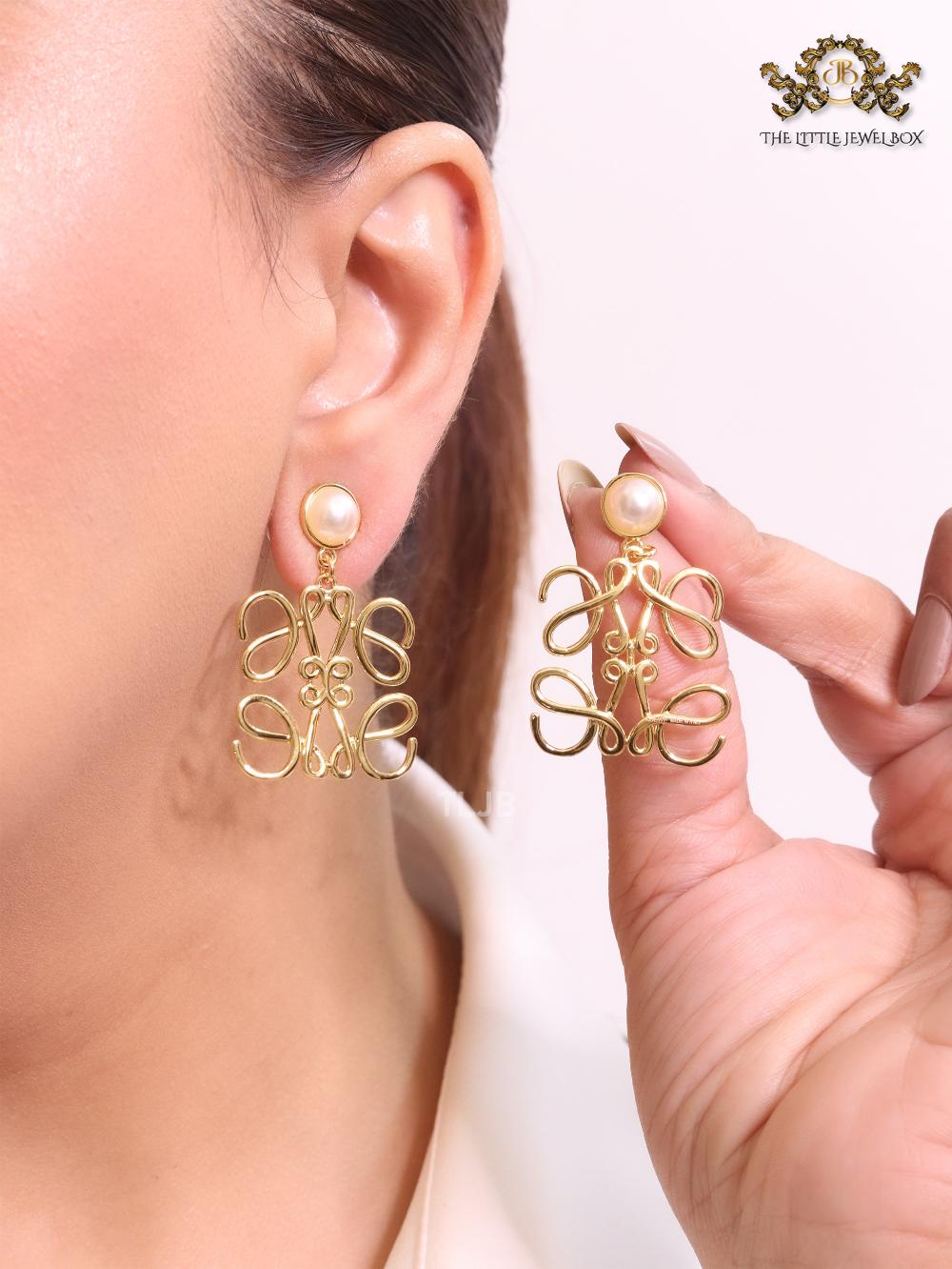 Alphabet L pearl and gold danglers