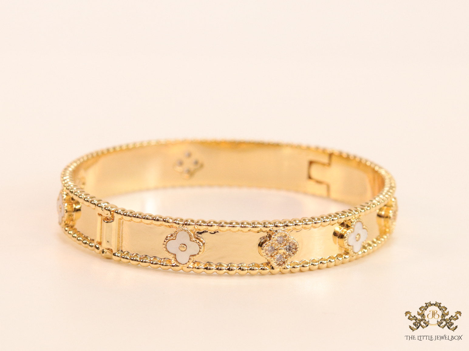 Gold plated bracelet with clover motifs in cz and MOP