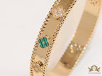 Gold plated bracelet with clover motifs in cz and malachite green