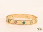 Gold plated bracelet with clover motifs in cz and malachite green