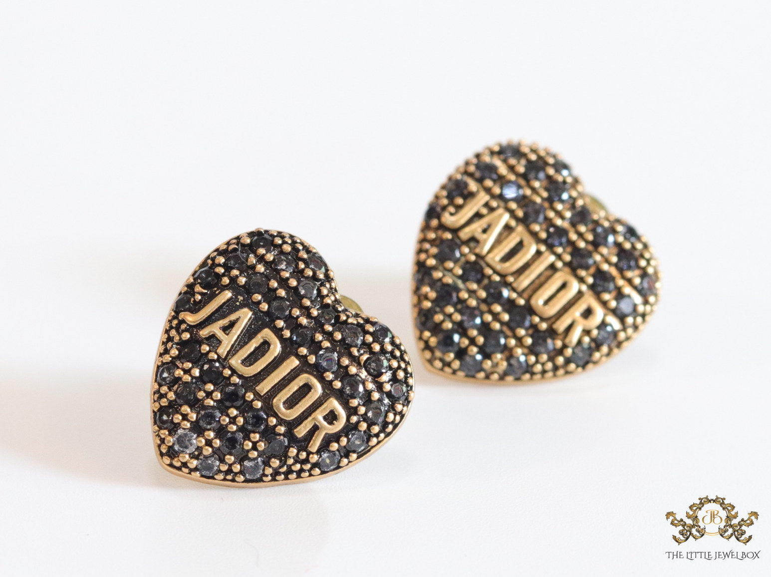 Heart shaped alphabet stud earrings in golden and black finish