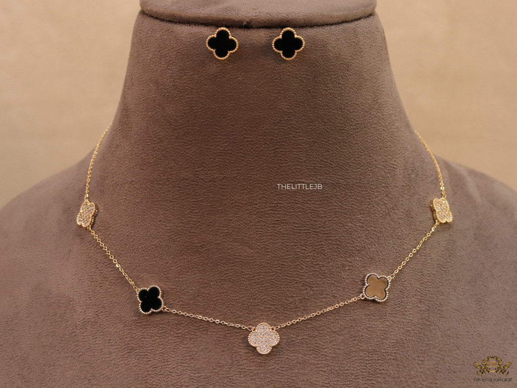 Gold plated necklace set with cz and black enamel coated clovers