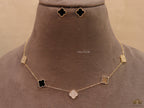 Gold plated necklace set with cz and black enamel coated clovers