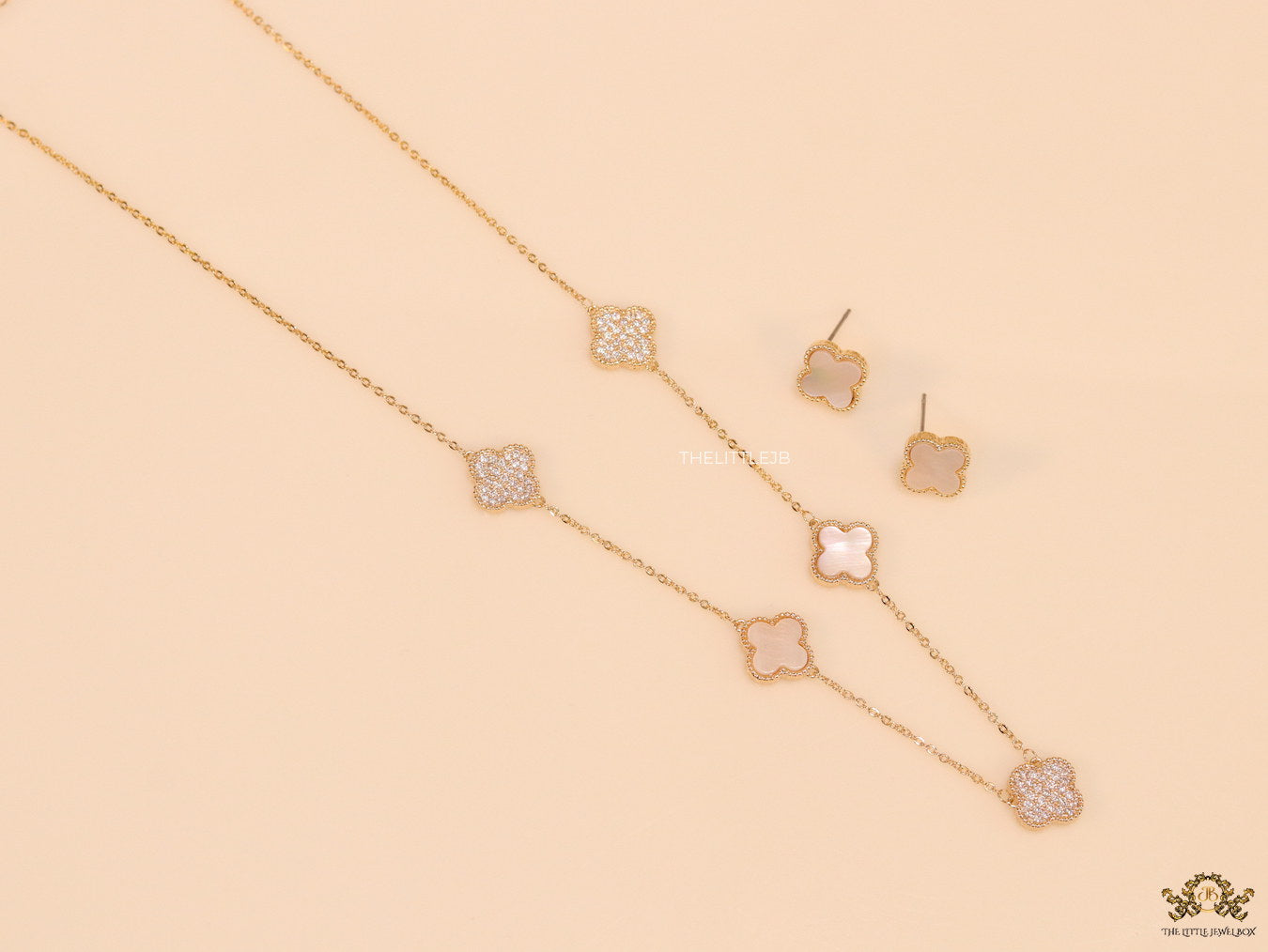 Gold plated necklace set with cz and mother of pearl clovers
