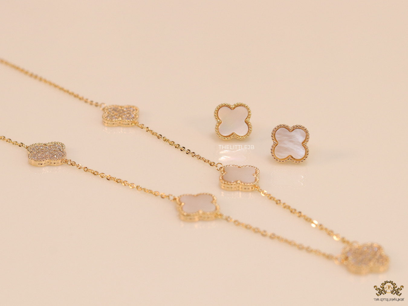 Gold plated necklace set with cz and mother of pearl clovers