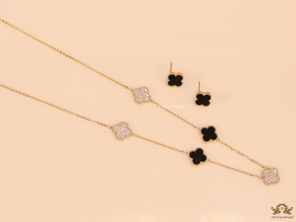 Gold plated necklace set with cz and black enamel coated clovers