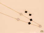 Gold plated necklace set with cz and black enamel coated clovers