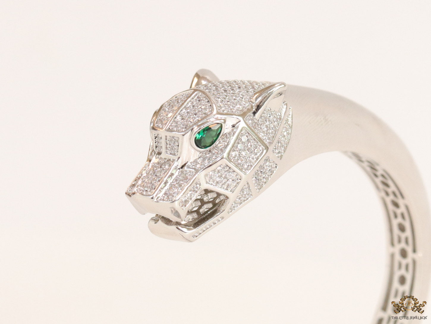 Platinum plated open panther bracelet with cz