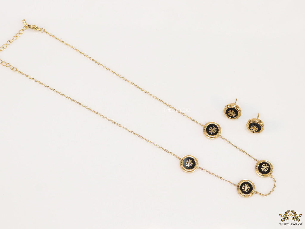 Gold plated necklace set with T motif black enamel coated discs