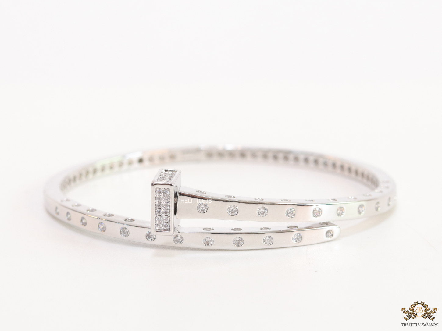 Platinum plated cz bracelet with cz head