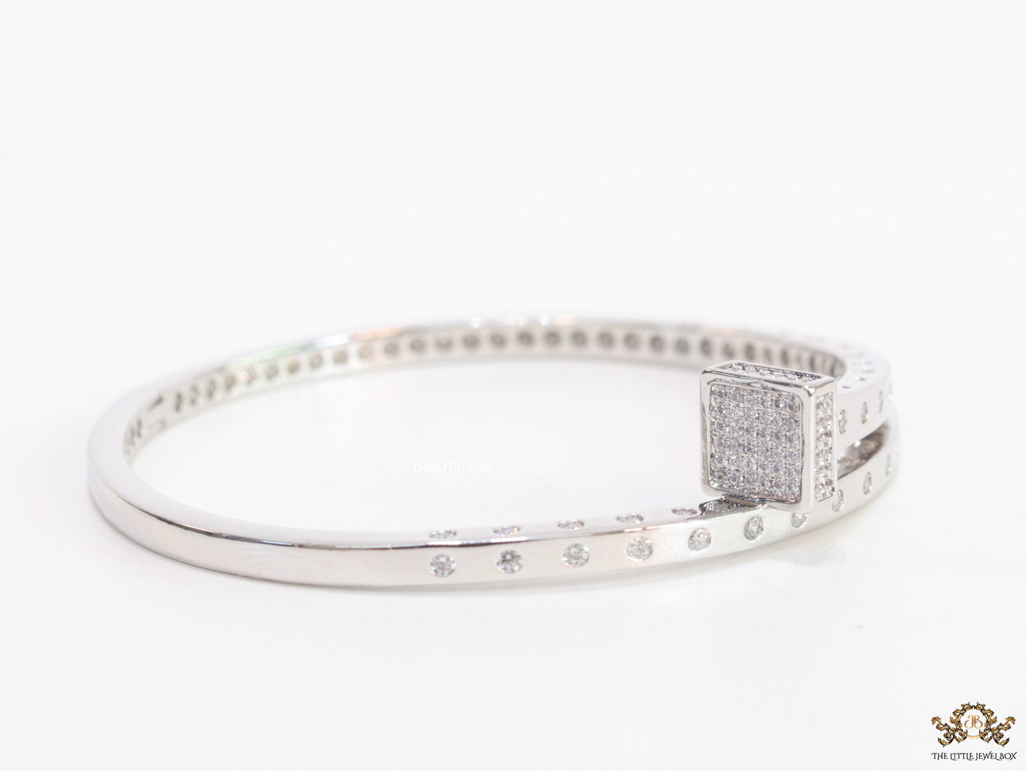 Platinum plated cz bracelet with cz head