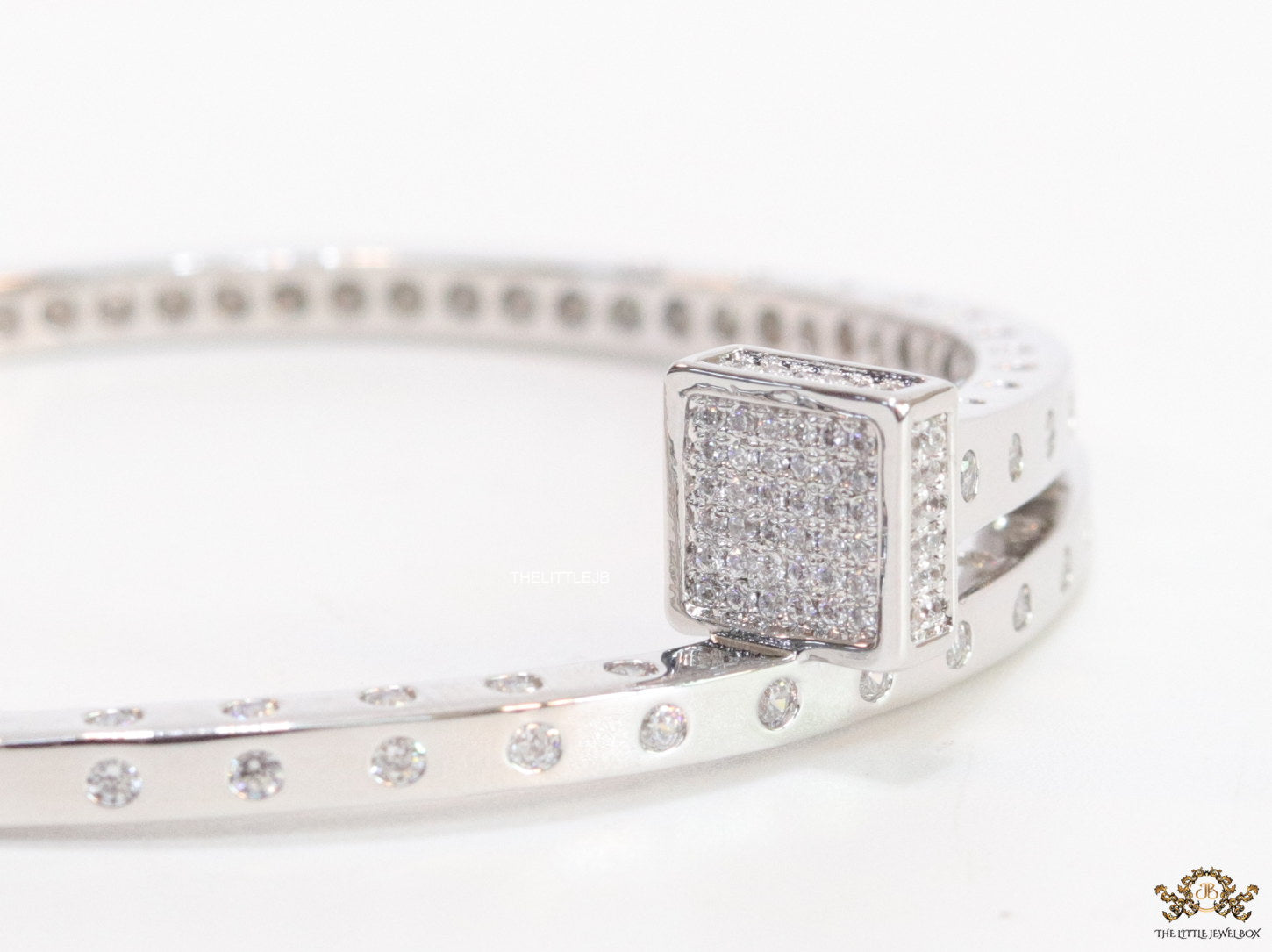 Platinum plated cz bracelet with cz head