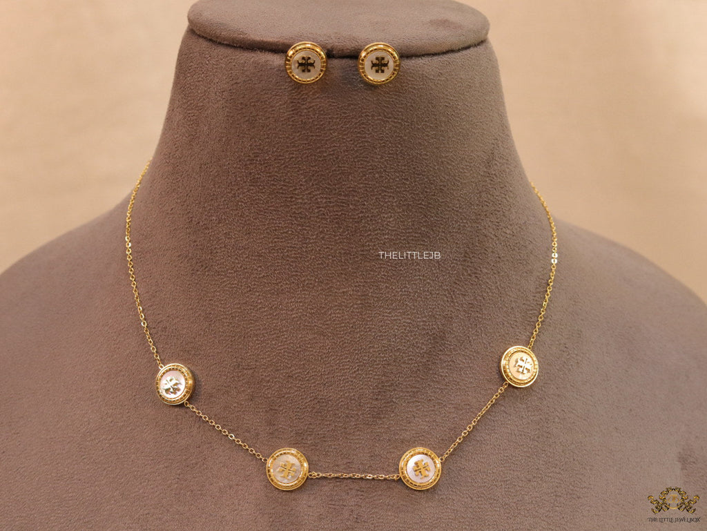 Gold plated necklace set with T motif mother of pearl discs